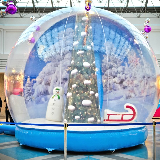 Inflatable human snow globe